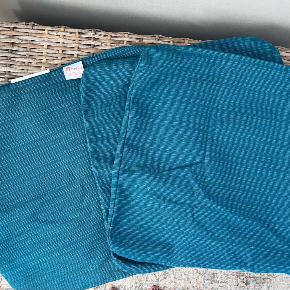 Three Sunbrella pillowcase covers. Size: 17 X 17